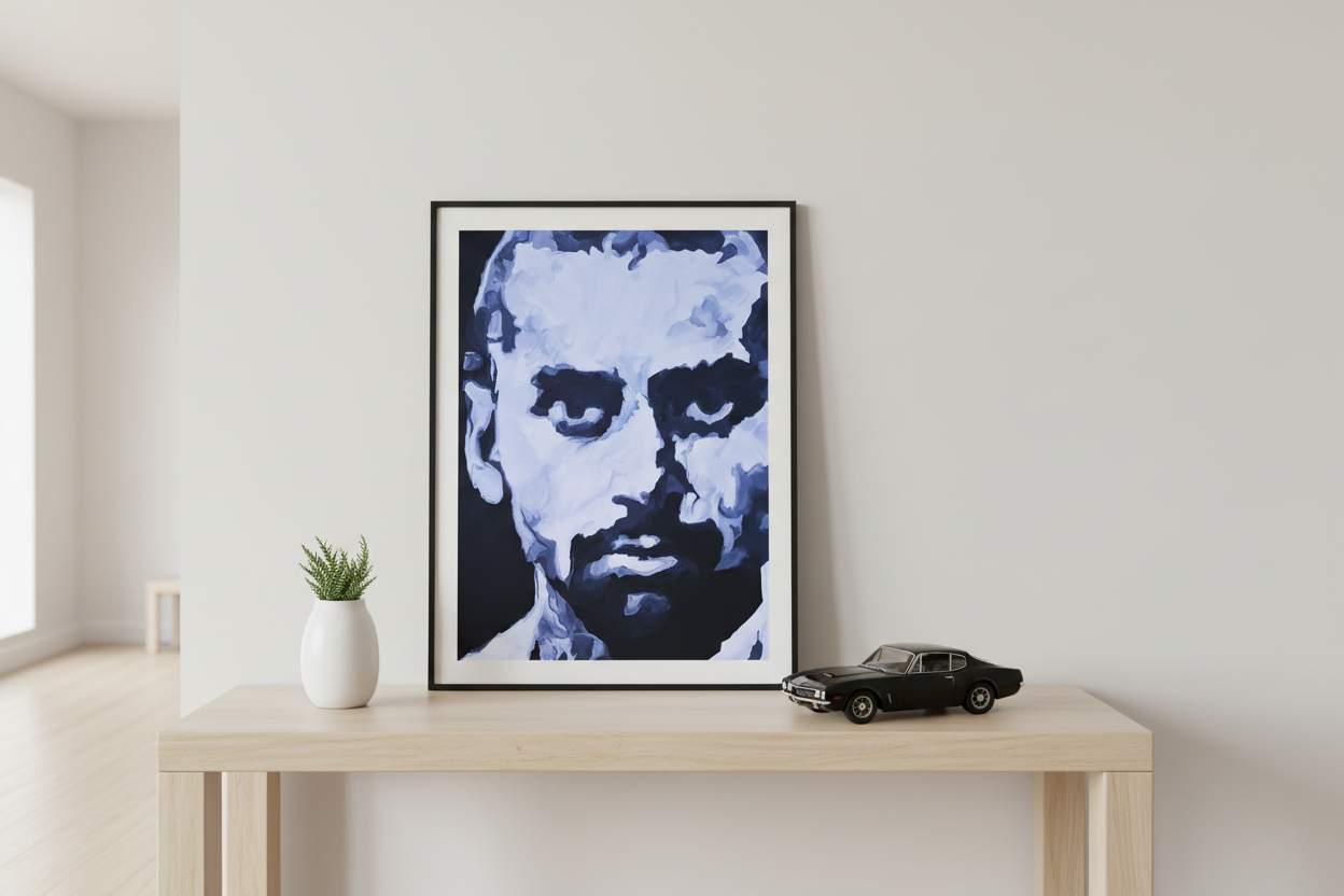 24x36 poster in thin black frame on entry table with vintage car