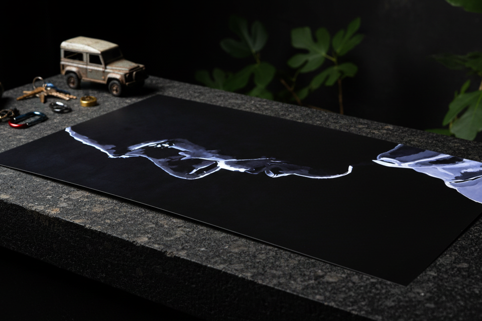 24x36 poster on granite with Defender toy car and outdoor gear